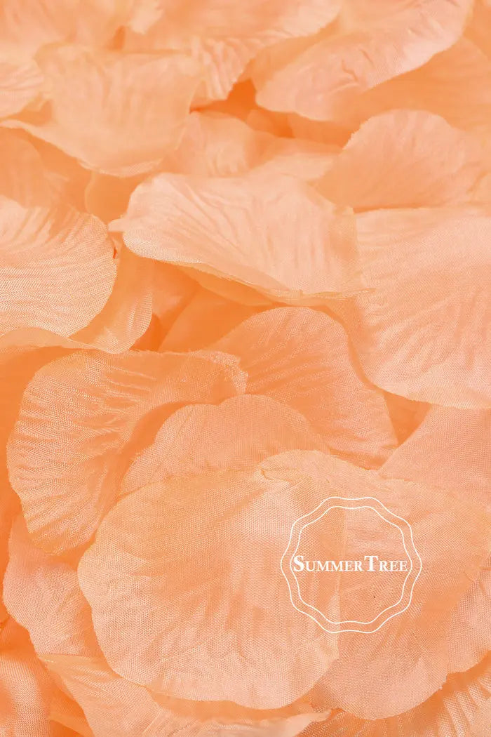 A close-up of soft peach silk rose petals used for weddings and events.