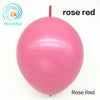 A single, smooth, pink latex balloon is shown against a white background.