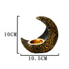 A black crescent-shaped resin incense burner with gold accents, shown with dimensions.