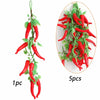 A sprig of artificial red chili peppers on a green stem, shown next to a circular display of five pieces.