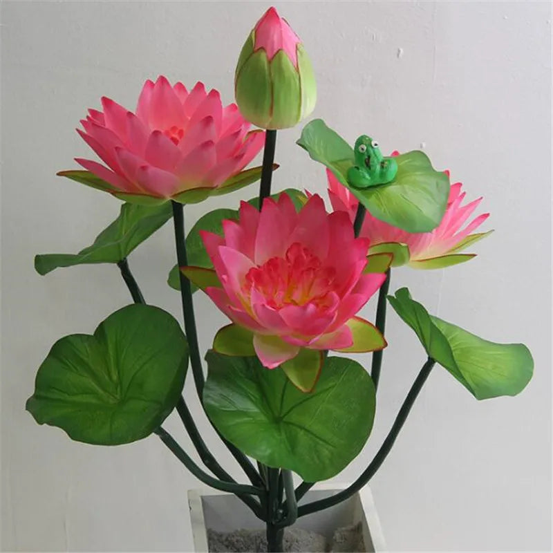 Artificial lotus flower bunch with pink blooms and green frog accents on dark stems.