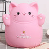 A pink cartoon cat piggy bank with smiling features and the text Smile Wonderful on its surface.