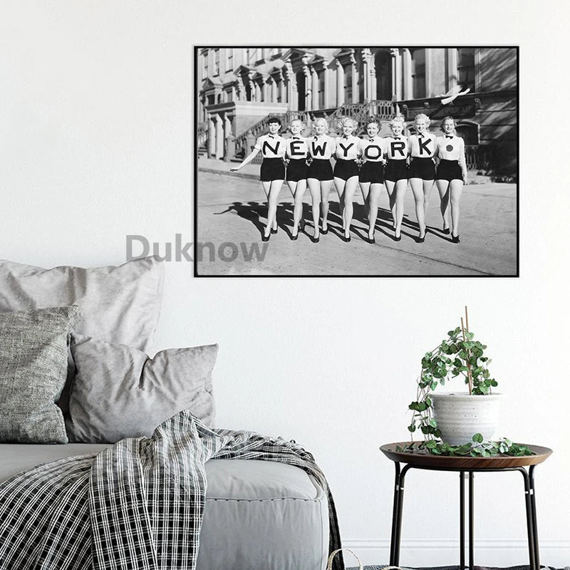 Black and white vintage print of a group of women in flapper style posing outdoors