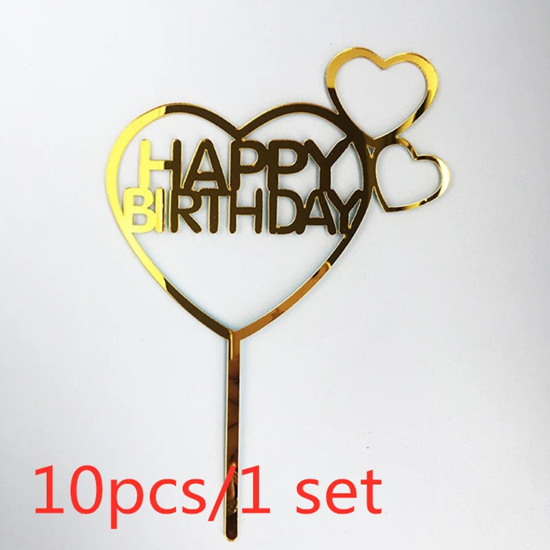 A set of ten gold acrylic love heart birthday cake toppers shaped like a heart with the words HAPPY BIRTHDAY inside.