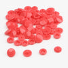 A pile of assorted bright pink snap buttons, measuring 12mm and 10.5mm, for crafting.