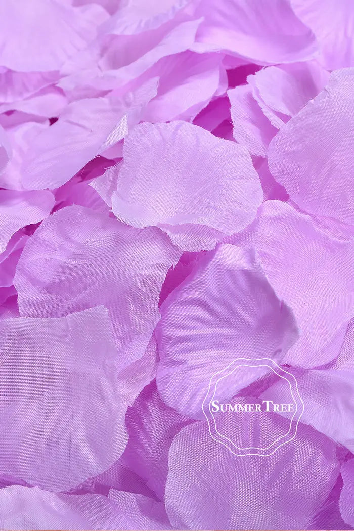 A close-up of purple silk rose petals used for weddings and events.