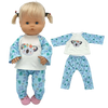 A light blonde doll wearing a blue and white patterned outfit set with matching pants and a top featuring a koala design.