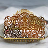 Gold pearl laser cut wedding invitations featuring intricate brown filigree designs