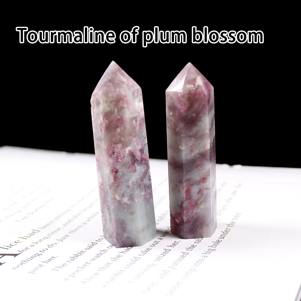 A translucent pink tourmaline crystal point prism tower for meditation and home decor.