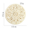 A circular wooden board marked with zodiac signs and months used for constellation pendulum divination.