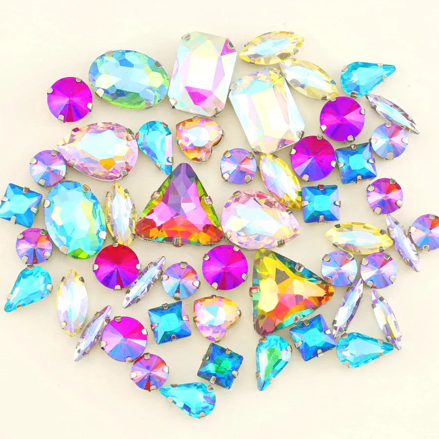 A mix of iridescent glass rhinestones in various colors including pink, blue, green, and clear shades.