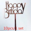 A set of ten gold acrylic letters spelling out Happy Birthday on a stick.