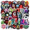A collection of colorful horror skull and zombie decals for laptops and accessories.