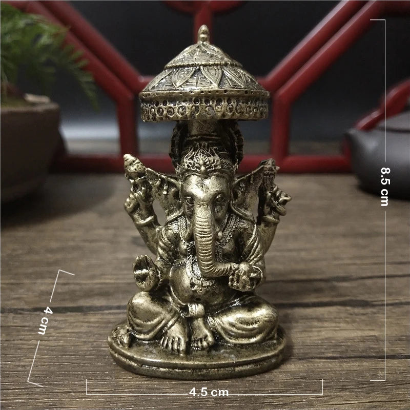 Bronze Ganesha Buddha statue with a conical crown sitting on a round base.
