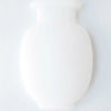A white, smooth, vase-shaped object designed for self-adhesive wall mounting.