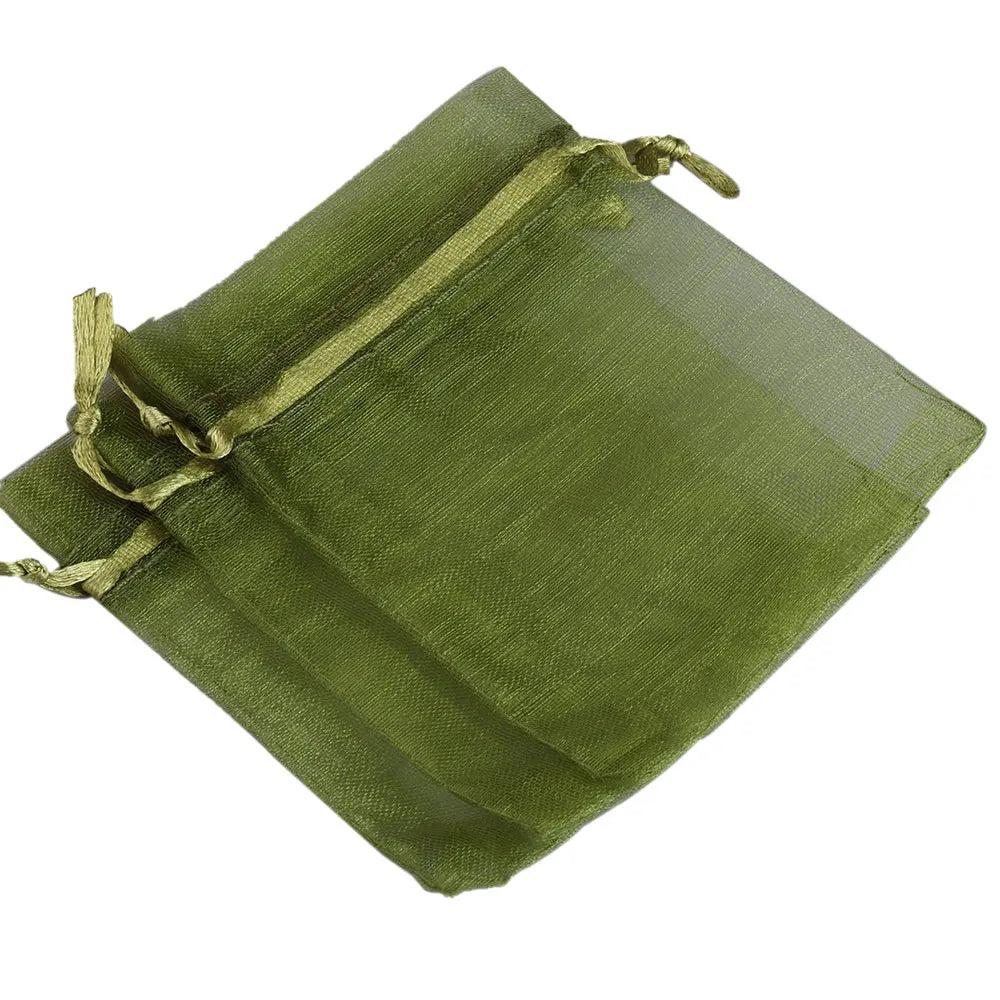 Green organza drawstring gift pouches stacked together
