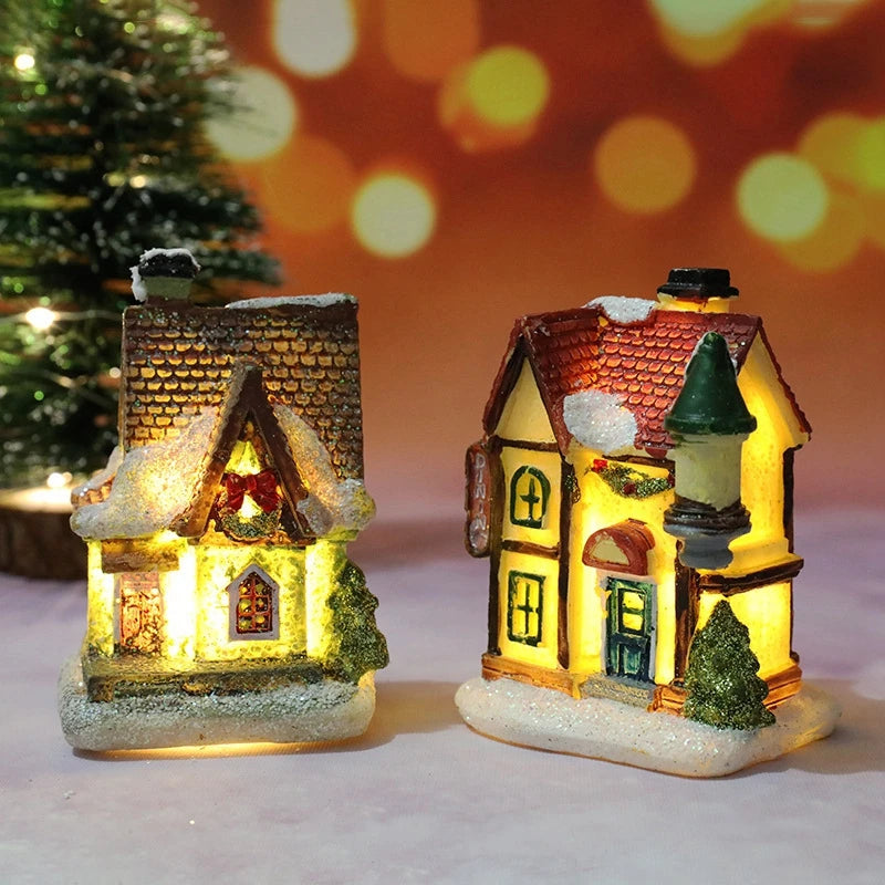 A festive Christmas house night light featuring a warm LED glow and detailed facade on a snowy base.