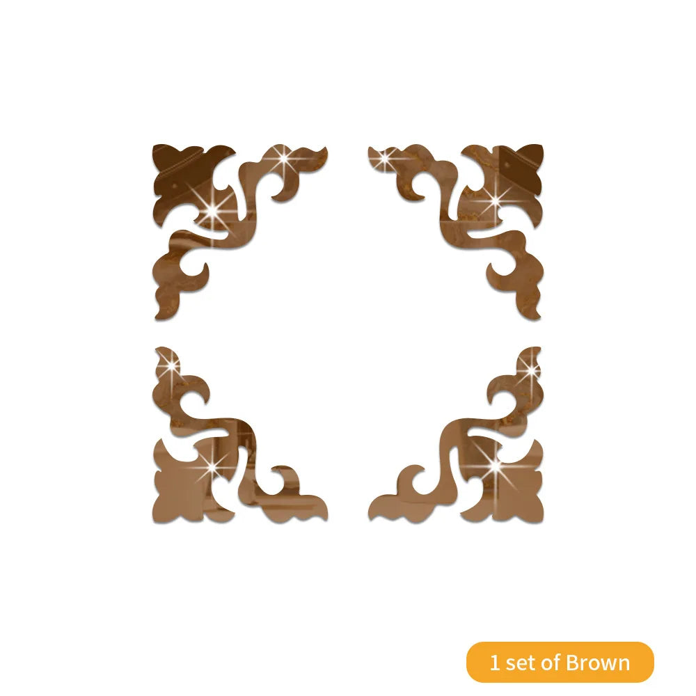 A set of brown 3D acrylic mirror wall stickers with decorative scrollwork designs.