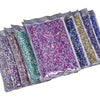 A collection of clear pouches filled with various colors and sizes of hotfix glass rhinestones.