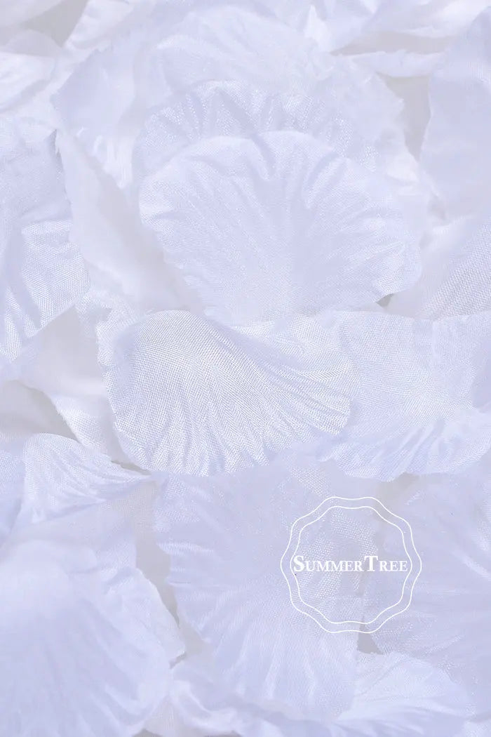 White silk rose petals for weddings and events arranged in a pile.