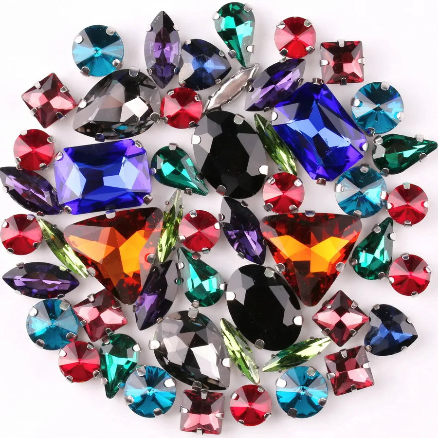 A collection of iridescent glass rhinestones in various colors including blue, green, pink, and purple.