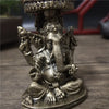 Bronze Ganesha Buddha statue for home decor featuring a seated deity with multiple arms.