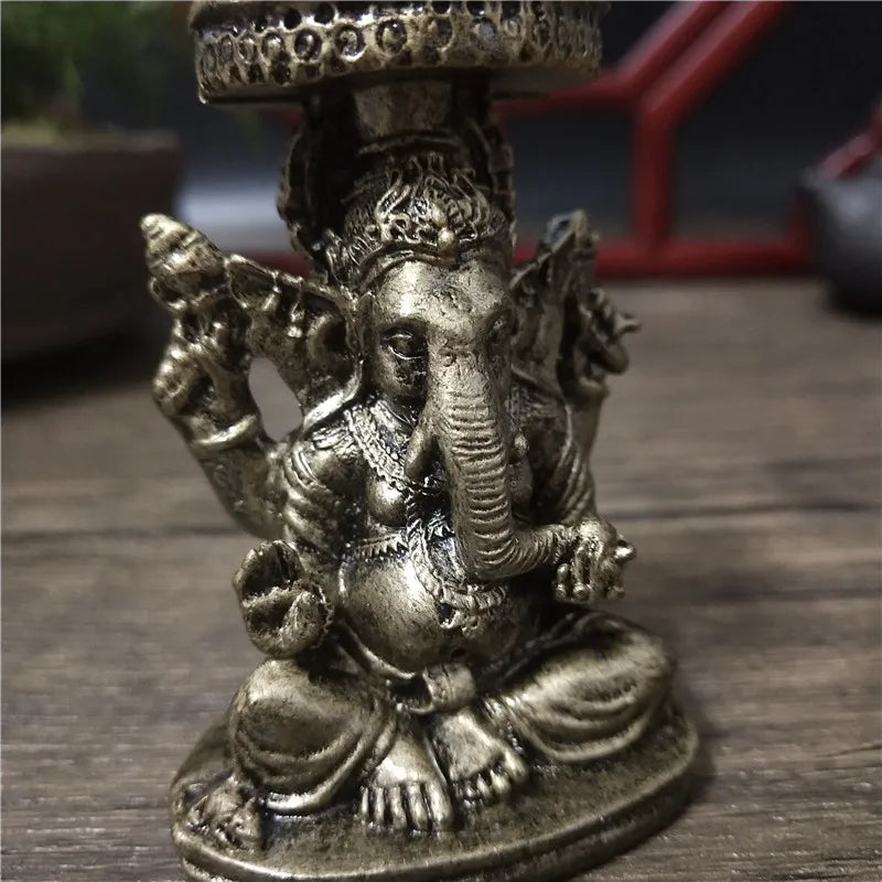 Bronze Ganesha Buddha statue for home decor featuring a seated deity with multiple arms.