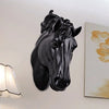 A black 3D resin horse head wall sculpture mounted on a white wall.