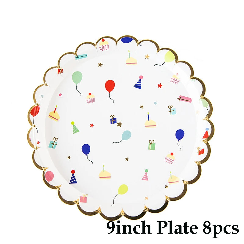 A white plate decorated with colorful paper party balloons and small paper food items for a children's event.