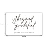 A white thank you card with handwritten text that says beyond grateful and thank you so much