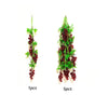 Two arrangements of artificial red berries and green leaves for decoration