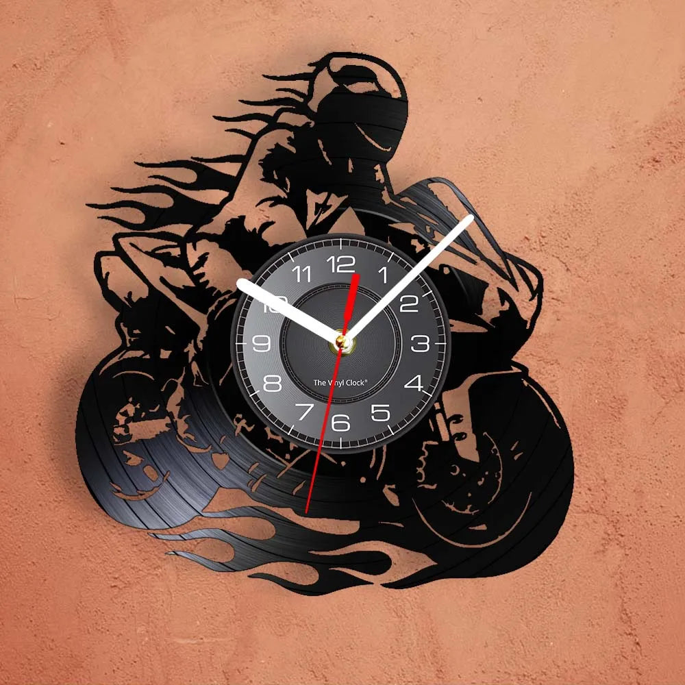 A black silhouette of a motorcycle rider is embossed on a vinyl record-themed wall clock.