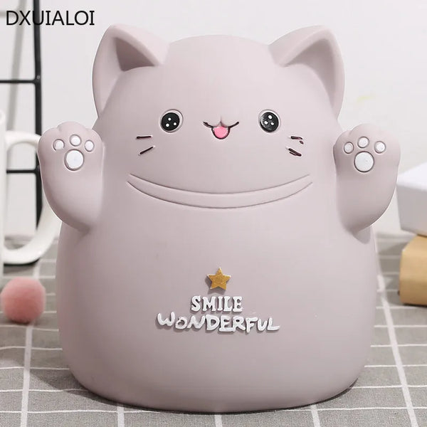 A cute, light pink cartoon cat figure designed as a piggy bank or money saving box for kids.
