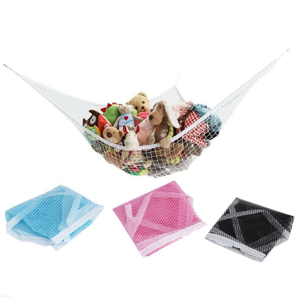 A large mesh toy hammock is filled with stuffed animals and used for storage.