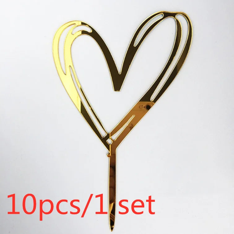 A set of ten gold acrylic heart-shaped cake toppers with a stick for decoration.