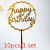 A set of ten gold acrylic love happy birthday cake toppers shaped like a wreath on a stick.