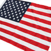 A large American flag banner featuring the stars and stripes design.