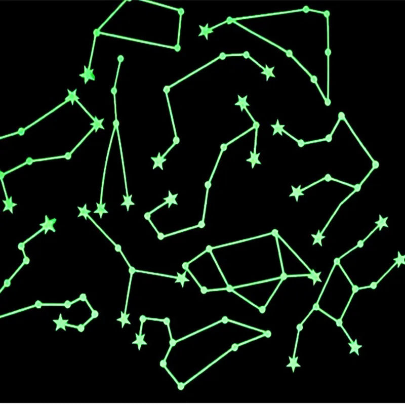 A collection of glowing green line art shapes resembling stars and moons on a black background.