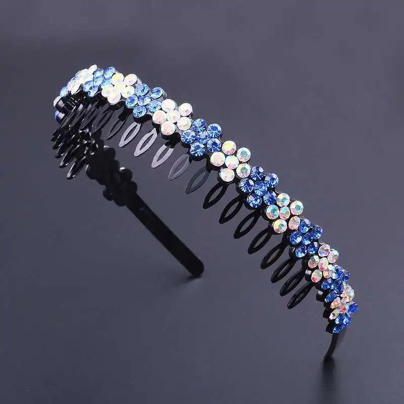 A black headband decorated with blue and white crystal rhinestones.