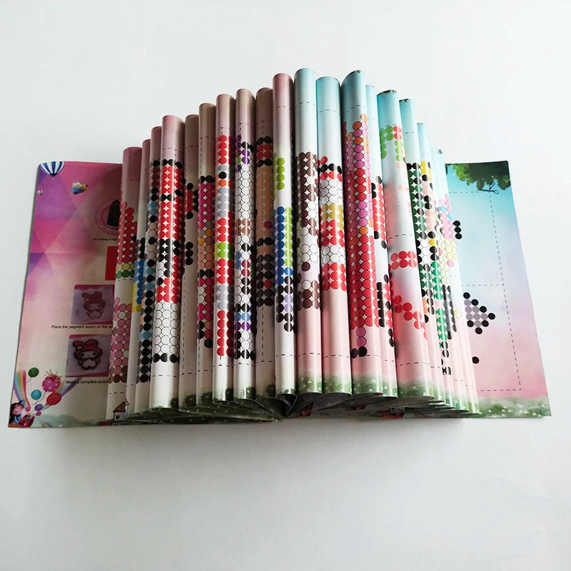 A display of 10 colorful tubes of fuse beads for DIY ironing projects arranged in a vertical row.