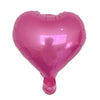 Ein einzelner rosa herzförmiger Folienballon.