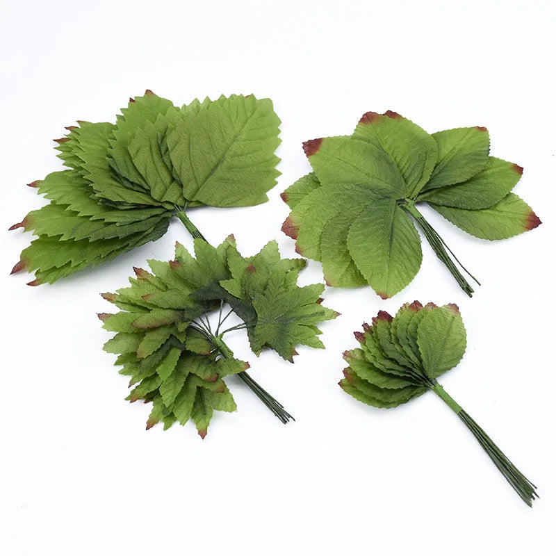 A set of twelve artificial silk leaf plant stems used for vases.
