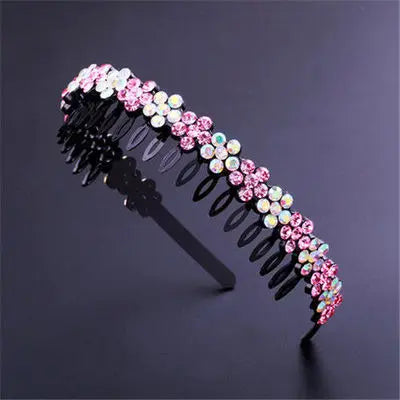 A black headband decorated with pink and clear crystal rhinestones.