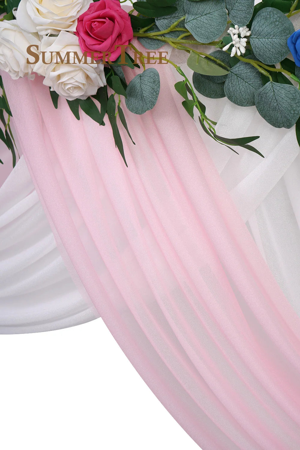 Pink sheer chiffon fabric drape with green foliage and white roses used for wedding or event decor