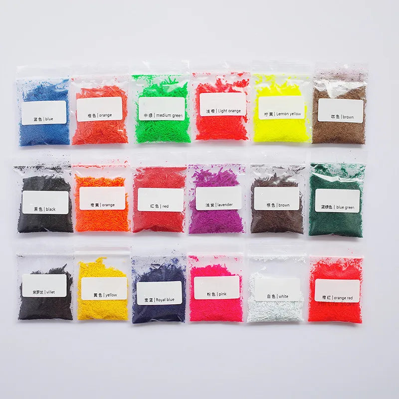 A collection of brightly colored, fine powder dye colorants in small plastic bags for DIY wax projects.