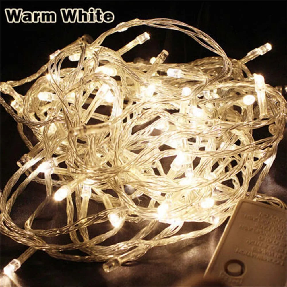 A bundle of warm white LED string lights tangled together, ready for holiday decoration.