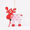 Hand-painted wooden deer ornament with red antlers and pink body, hanging by twine.