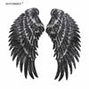 A pair of large, black sequin wing patches for DIY sew-on or iron-on embellishment.