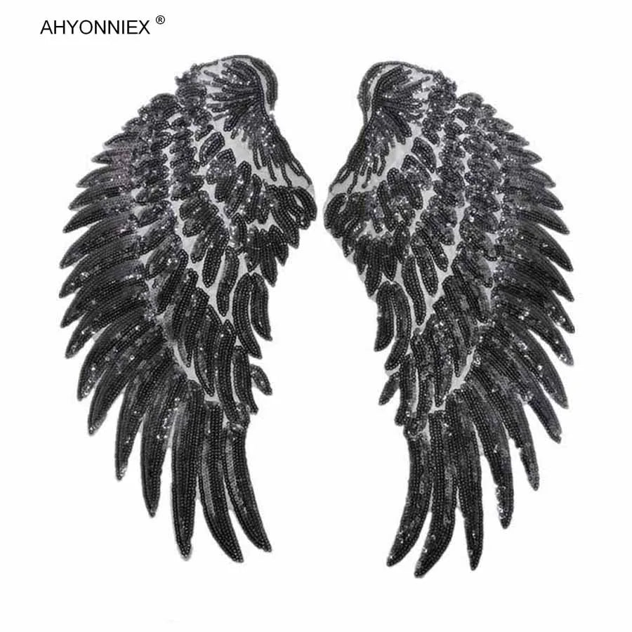 A pair of large, black sequin wing patches for DIY sew-on or iron-on embellishment.