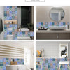 A shower room featuring decorative mandala tile stickers on the walls and floor, with a white sink and modern fixtures.
